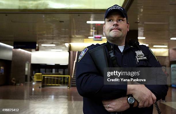 Port Authority Police Officer patrols the Port Authority Bus terminal on November 26, 2015 in New York City. Security has been increased at all major...