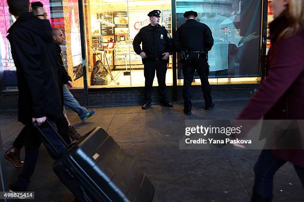 Port Authority Police Officers patrol the area around the Port Authority Bus terminal on November 26, 2015 in New York City. Security has been...