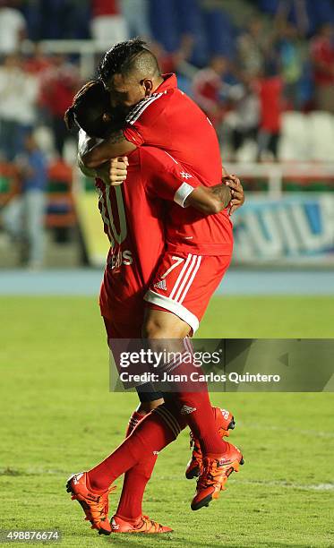 Anibal Hernandez of Amereica de Cali celebrates with Yesus Cabrera after scoring the second goal of his team during a match between America de Cali...