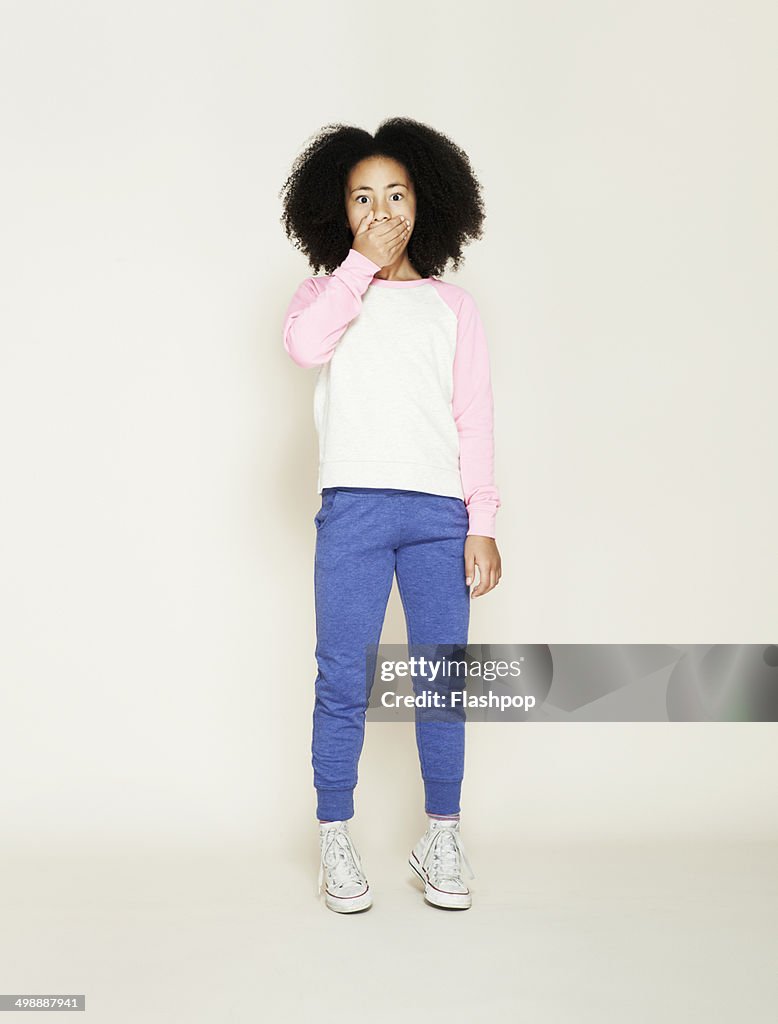 Portrait of girl pulling funny face