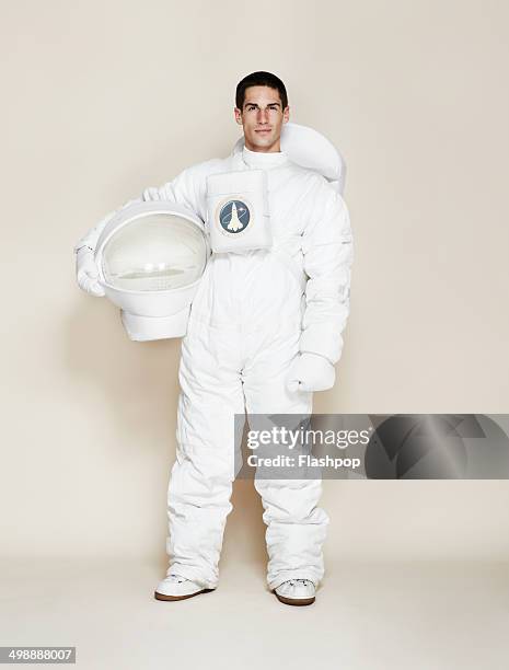 man dressed as an astronaut - astronauta fotografías e imágenes de stock