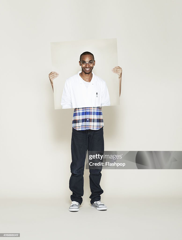 Child holding picture of inspirational person