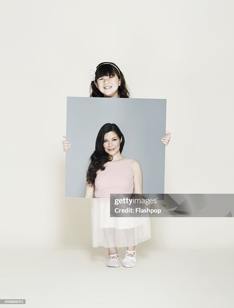 Child holding picture of inspirational person