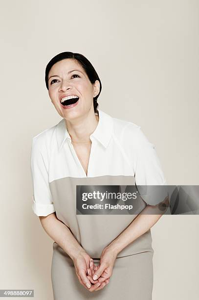 portrait of business woman smiling - woman studio stock pictures, royalty-free photos & images