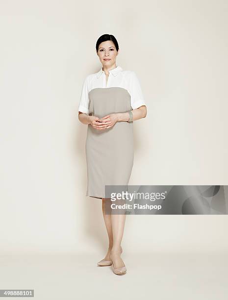 portrait of business woman smiling - full length stock pictures, royalty-free photos & images