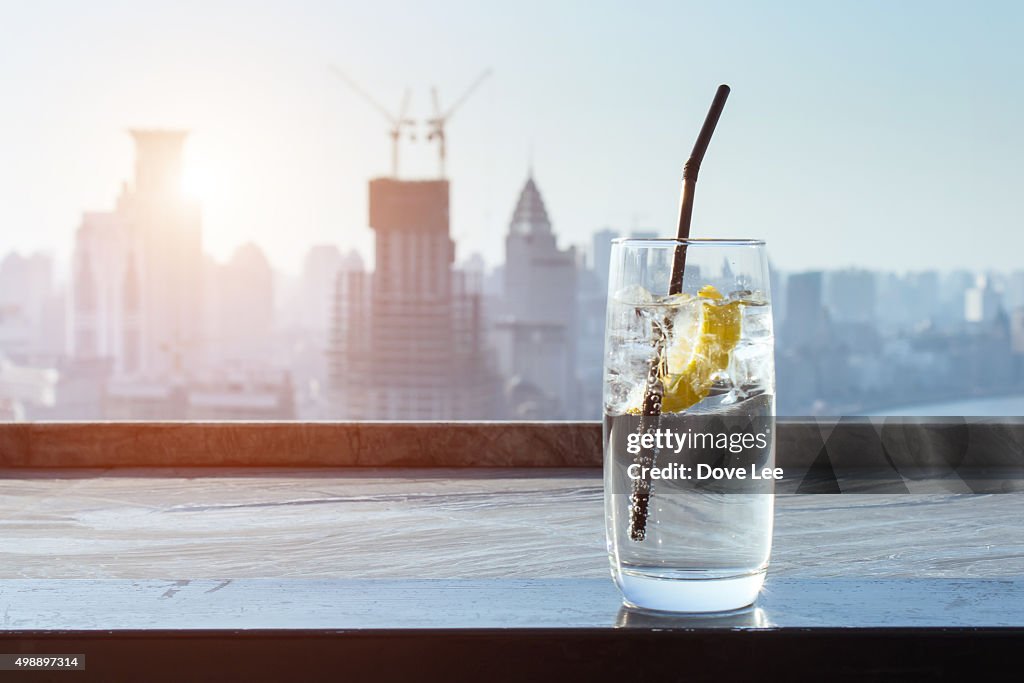 Lemon drinks with city background