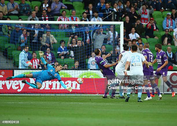 Connor Chapman of Melbourne City heads the ball past Perth Glory goalkeeper Ante Covic to score during the round eight A-League match between...