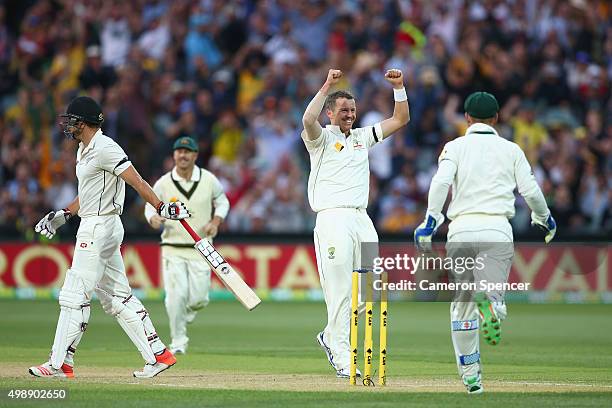 Peter Siddle of Australia celebrates dismissing Doug Bracewell of New Zealand, his 200th test wicket during day one of the Third Test match between...