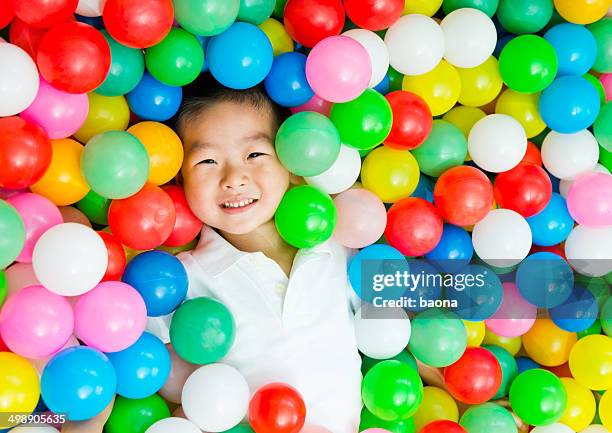 boy on the balls - child playground overhead stock pictures, royalty-free photos & images