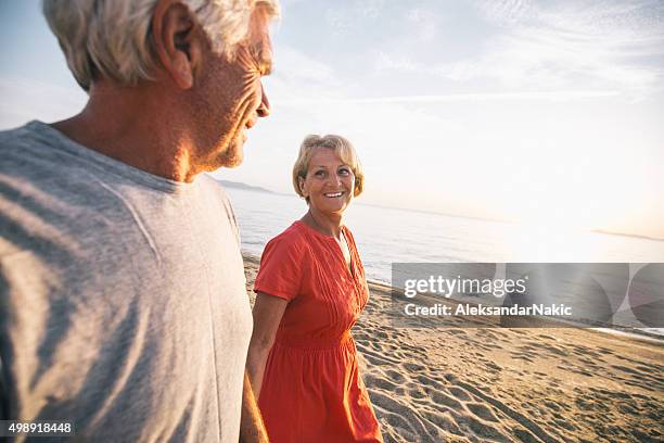 golden years - old couple holding hands stock pictures, royalty-free photos & images