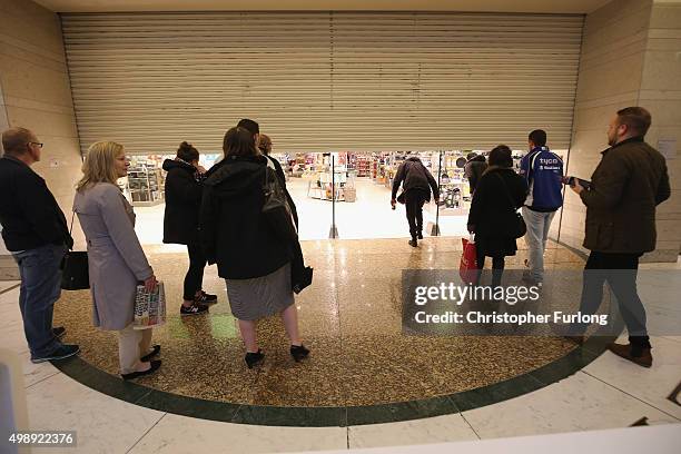 Shoppers wait for the the John Lewis store to open at 8am, inside The Trafford Centre, with the hope of a 'Black Friday' bargain on November 27, 2015...