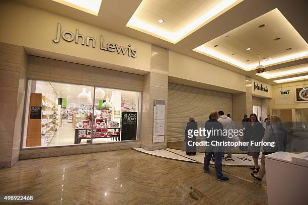 Shoppers wait for the the John Lewis store to open at 8am, inside The Trafford Centre, with the hope of a 'Black Friday' bargain on November 27, 2015...