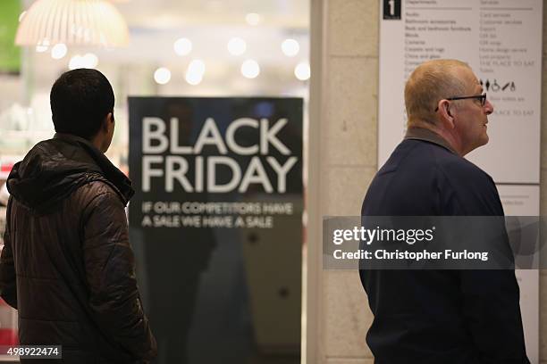 Shoppers wait for the the John Lewis store to open at 8am, inside The Trafford Centre, with the hope of a 'Black Friday' bargain on November 27, 2015...