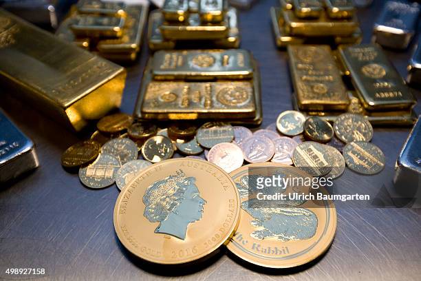 Gold bullions, silver bullions and gold coins in the strong room of pro aurum goldhouse in Munich.