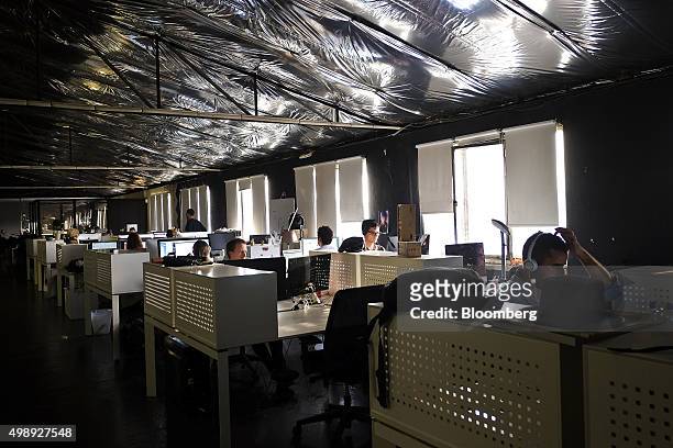 Tech entrepreneurs use their laptops in the offices of CoworkLisboa which provides office space for start-ups in Lisbon, Portugal, on Wednesday, Nov....