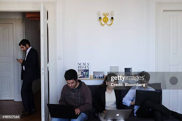 Users of the LINNK Lisbon Innovation Kluster workspace work on laptops in the common room in Lisbon, Portugal, on Wednesday, Nov. 18, 2015. Portugal...