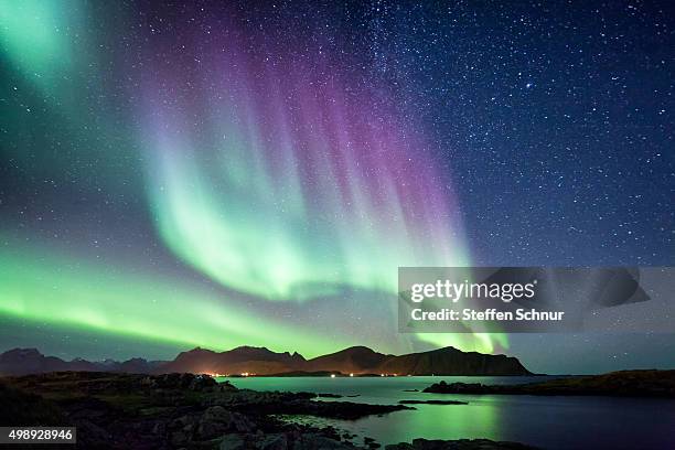 beautiful northern lights aurora borealis borealisgreen norway nature - landscape purple stock-fotos und bilder