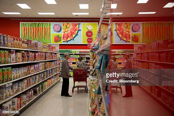 Customers shop at a Target Corp. Store in Jersey City, New Jersey, U.S., on Friday, Nov. 27, 2015. In 2011, several big U.S. Retailers moved their...