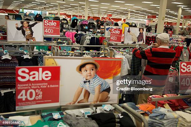 Customer browses clothing at a Target Corp. Store in Jersey City, New Jersey, U.S., on Friday, Nov. 27, 2015. In 2011, several big U.S. Retailers...