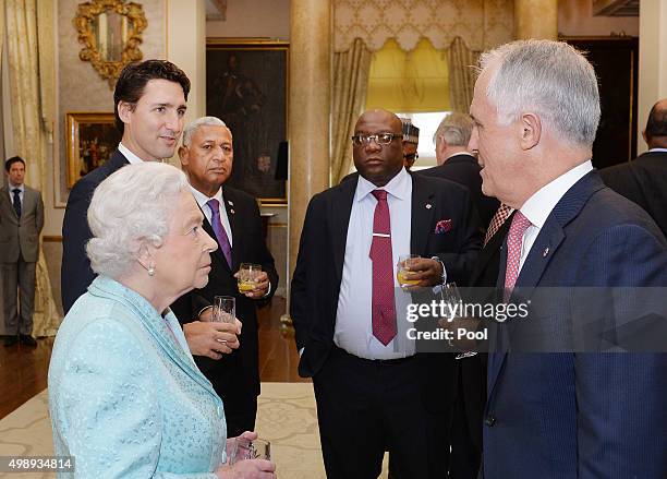 Queen Elizabeth II talks to Australian Prime Minister Malcolm Turnbull during a Heads of Government reception at the San Anton Palace on November 27,...