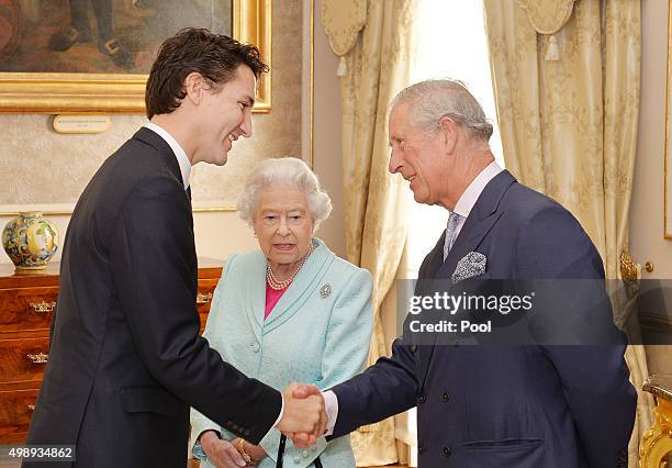 Prime Minister of Canada Justin Trudeau talks to Queen Elizabeth II and the Prince Charles, Prince of Wales during a Heads of Government reception at...