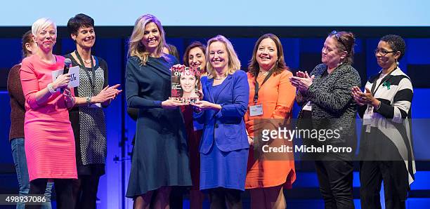 Queen Maxima of The Netherlands wearing a dress by Danish designer Claes Iversen receives the first copy of the Kracht on Tour Magazine from...