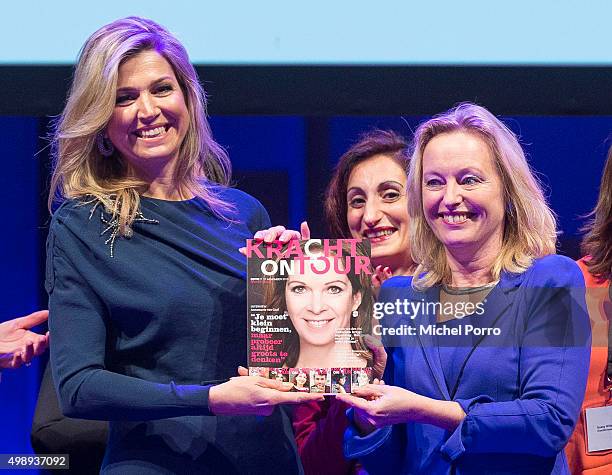 Queen Maxima of The Netherlands wearing a dress by Danish designer Claes Iversen receives the first copy of the Kracht on Tour Magazine from...