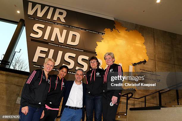 Manuel Neukirchner, director of the German Football Museum poses with Doris Fitschen, team manager, head coach Steffi Jones , assistant coach Ulrike...