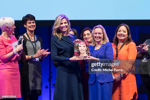 Queen Maxima of The Netherlands wearing a dress by Danish designer Claes Iversen receives the first copy of the Kracht on Tour Magazine from...
