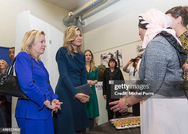 Queen Maxima of The Netherlands wearing a dress by Danish designer Claes Iversen and Education Minister Jet Bussemaker meets women during the "Kracht...