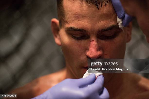 Artem Lobov gets advice from his corner in between rounds while facing Chris Gruetzemacher during the filming of The Ultimate Fighter: Team McGregor...