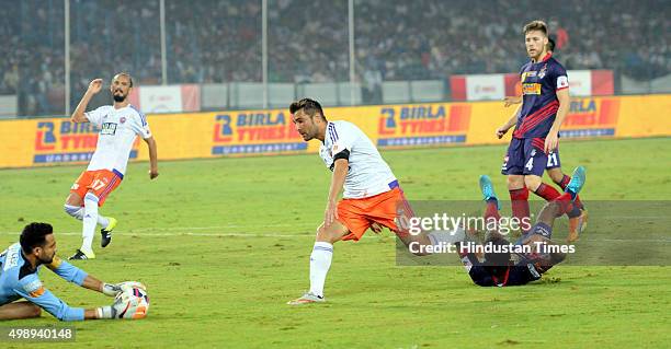 Pune City forward Adrian Mutu in action as Atletico De Kolkata Goal-keeper saves the ball during ISL match at Saltlake Stadium on November 27,2015...