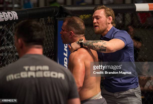 Head coach Conor McGregor congratulates Artem Lobov after knocking out Chris Gruetzemacher during the filming of The Ultimate Fighter: Team McGregor...