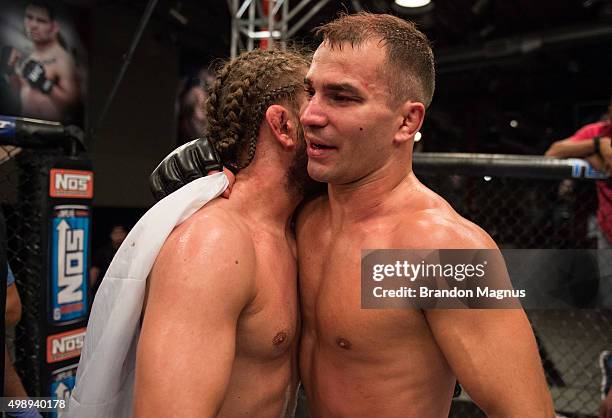 Artem Lobov hugs Chris Gruetzemacher after their fight during the filming of The Ultimate Fighter: Team McGregor vs Team Faber at the UFC TUF Gym on...