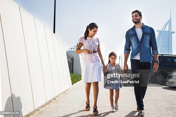 young family taking daughter to school - west asian culture stock pictures, royalty-free photos & images