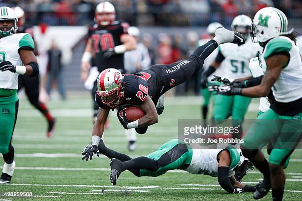 Anthony Wales of the Western Kentucky Hilltoppers gets tripped up while running with the ball against the Marshall Thundering Herd in the first half...