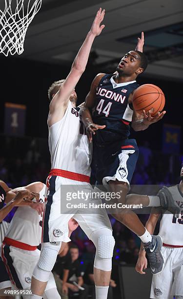 Connecticut Huskies guard Rodney Purvis shoots over Gonzaga Bulldogs center Przemek Karnowski during the third/fourth place game of the Battle 4...