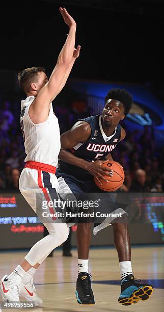 Connecticut Huskies forward Daniel Hamilton looks to pull up for a jumpshot against Gonzaga Bulldogs guard Kyle Dranginis during the third/fourth...