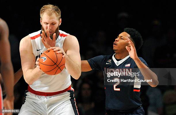 Connecticut Huskies guard Jalen Adams gets his arm caught under Gonzaga Bulldogs center Przemek Karnowski's during the third/fourth place game of the...