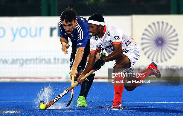 Luca Masso of Argentina vies with Birendra Lakra of India during the match between Argentina and India on day one of The Hero Hockey League World...