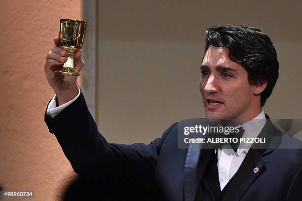 The youngest head of state of Commonwealth countries, Canadian Prime Minister Justin Trudeau, celebrates a toast in honor of Queen Elizabeth II...