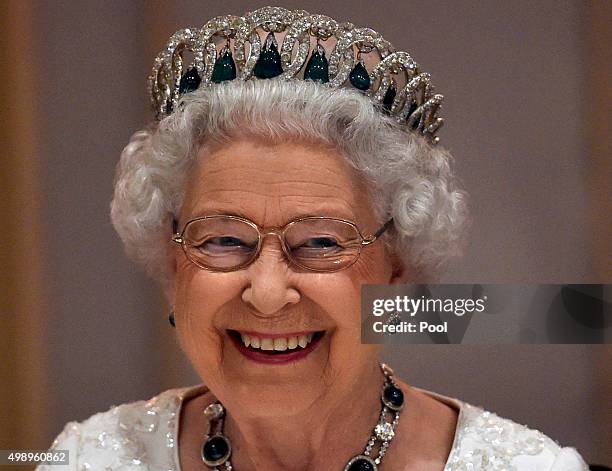 Queen Elizabeth II smiles as she attends a dinner at the Corinthia Palace Hotel in Attard during the Commonwealth Heads of Government Meeting on...