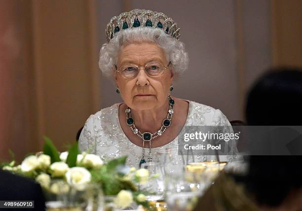 Queen Elizabeth II looks serious as she attends a dinner at the Corinthia Palace Hotel in Attard during the Commonwealth Heads of Government Meeting...