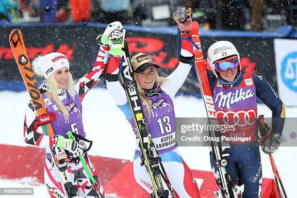 Lara Gut of Switzerland celebrates after winning the giant slalom along with Eva-Maria Brem of Austria in second place and Federica Brigone of Italy...