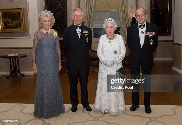 Camilla, Duchess of Cornwall, Prince Charles, Prince of Wales, Queen Elizabeth II and Prince Philip, Duke of Edinburgh pose as they attend a dinner...