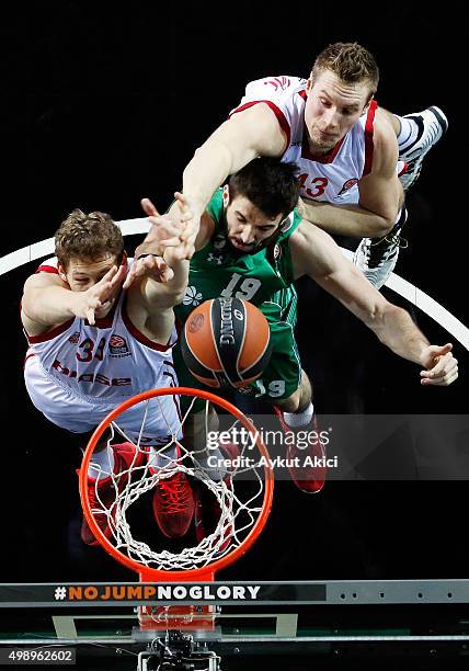 Furkan Aldemir, #19 of Darussafaka Dogus Istanbul competes with Patrick Heckmann, #33 of Brose Baskets Bamberg and Leon Radosevic, #43 of Brose...