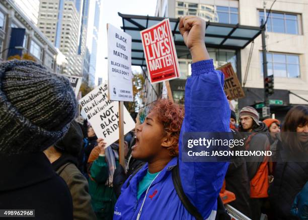 People march in the streets at a Black Lives Matter protest on Black Friday in Seattle, Washington on November 27, 2015.