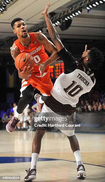 Syracuse's Michael Gbinije drives to the basket against Texas A&M's Tonny Trocha-Morelos in the championship game of the Battle 4 Atlantis at...