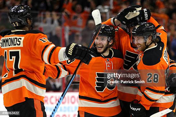 Shayne Gostisbehere of the Philadelphia Flyers celebrates with teammates after scoring the game-winning goal in overtime against the Nashville...