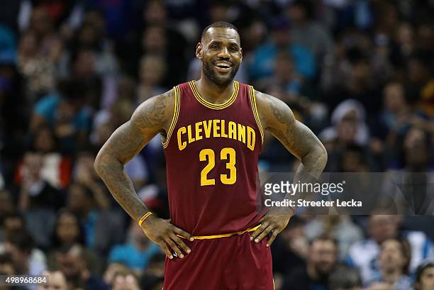 LeBron James of the Cleveland Cavaliers reacts during their game against the Charlotte Hornets at Time Warner Cable Arena on November 27, 2015 in...